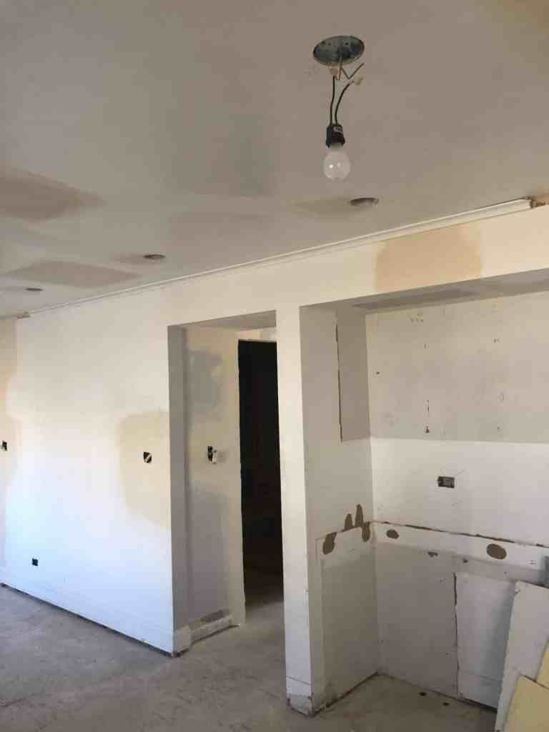Photo of newly installed drywall during kitchen construction