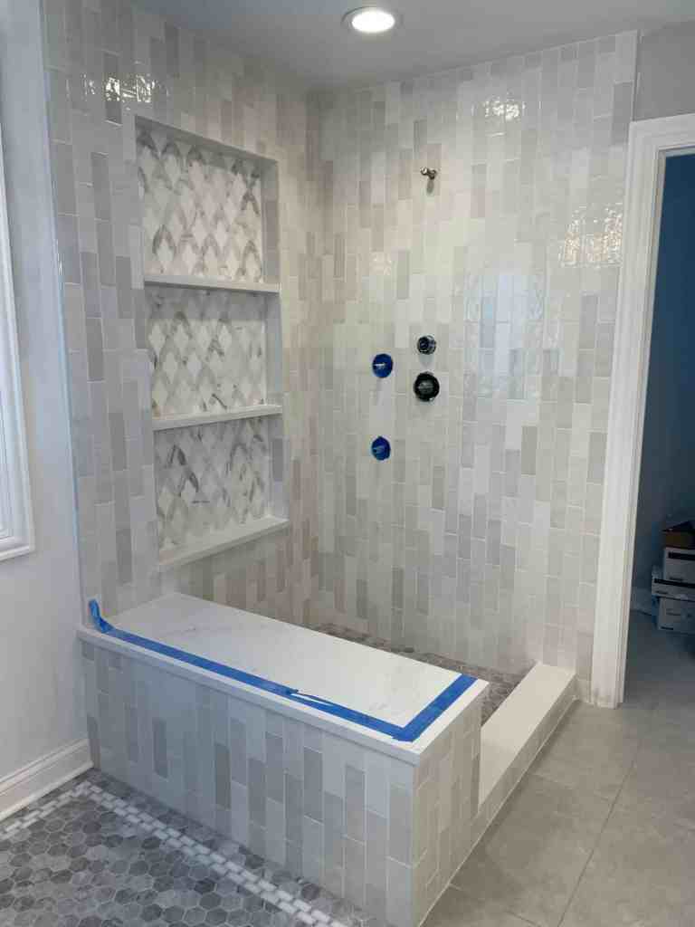 Photo of the shower with bench seat and tiled shower pan during the Arlington Heights remodel