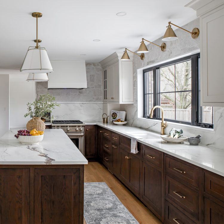 Recent kitchen design for remodel in Barrington featuring inset style custom cabinets, brass pendant lights and Oak island.
