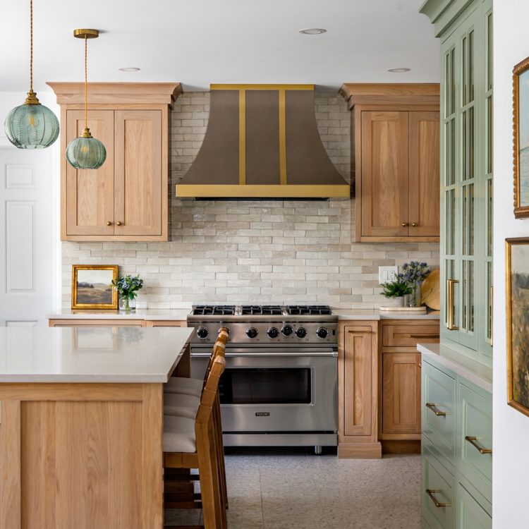 Kitchen remodel in Inverness featuring White Oak cabinets with Sage Green accents.