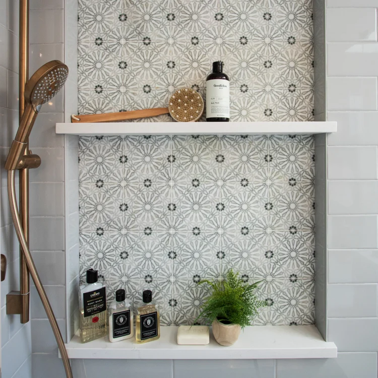 Recessed shampoo niche in a custom tiled shower from a bathroom remodel in Barrington.