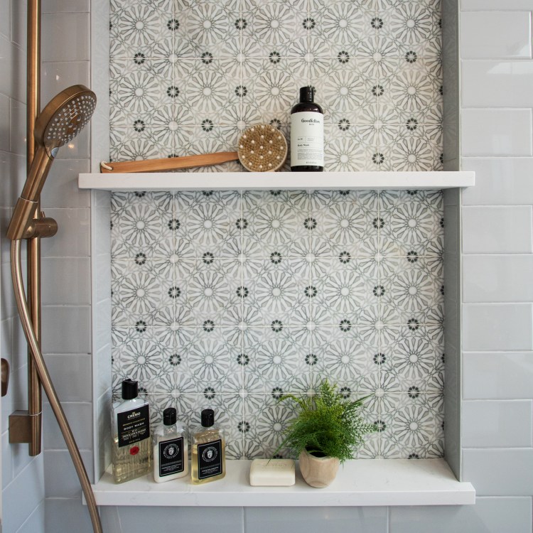 Recessed shampoo niche in a custom tiled shower from a bathroom remodel in Elk Grove Village.