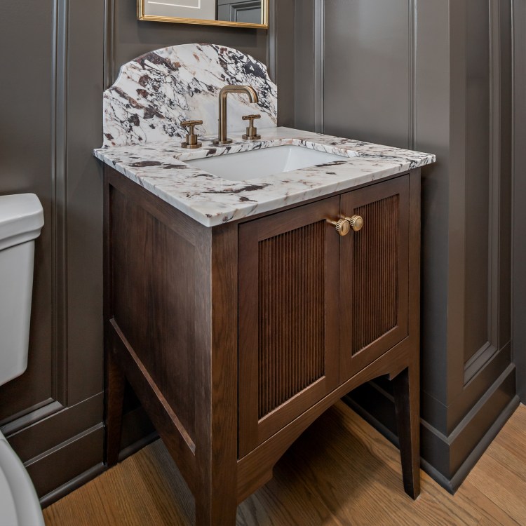 Custom furniture style bathroom vanity installed in a bathroom remodel in Riverwoods.