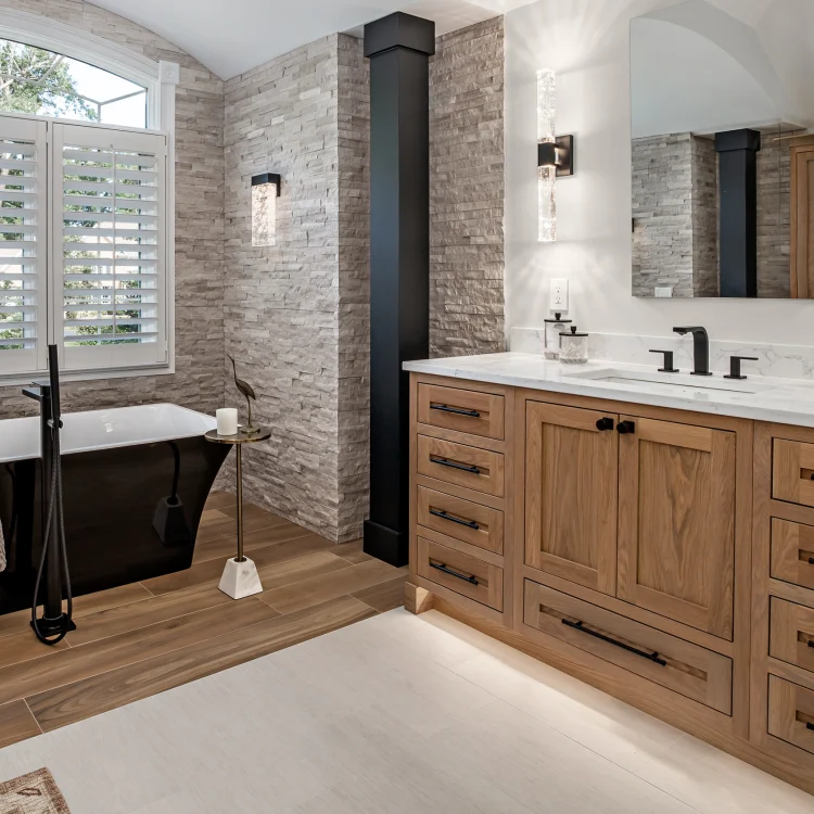 Luxury master bathroom remodel in Inverness featuring an Oak vanity and free standing tub.