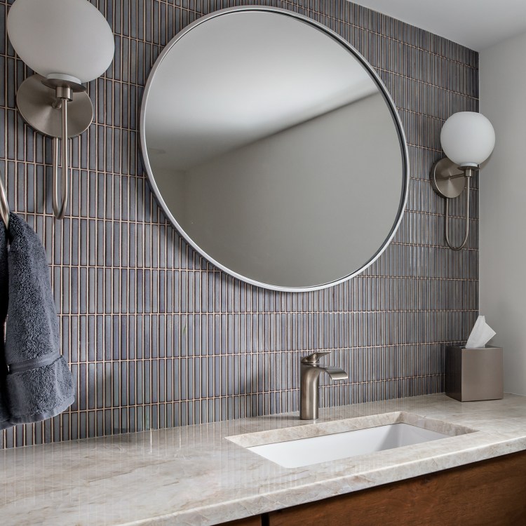 Recent hall bathroom remodel in Lake Zurich with custom tile and vanity.